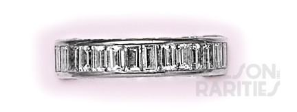 Channel-Set Baguette Diamond and Platinum Eternity Band Consisting of Three Rows of Channel Set Diamonds on all Sides. Size 5