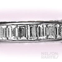 Channel-Set Baguette Diamond and Platinum Eternity Band Consisting of Three Rows of Channel Set Diamonds on all Sides. Size 5